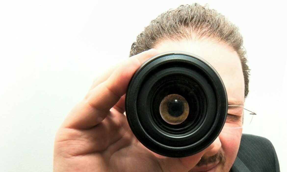 man peeping through monocular